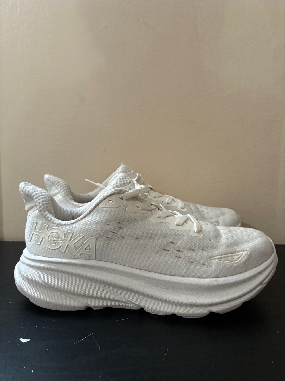 Hoka Clifton 9 running shoe featuring a signature all white size 7